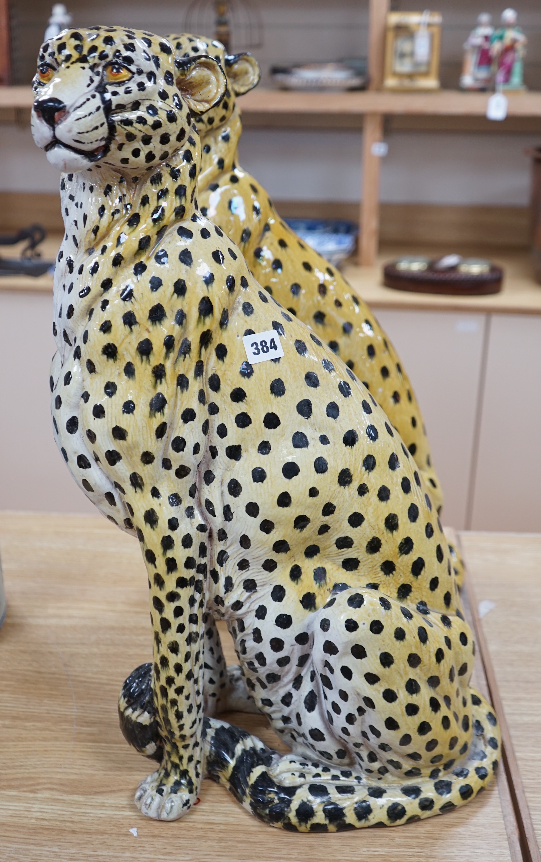 Two large Italian maiolica models of cheetahs, (one a.f), 63cm high